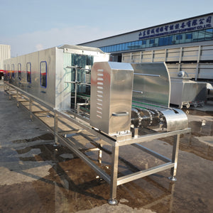 Poultry cage washing machine